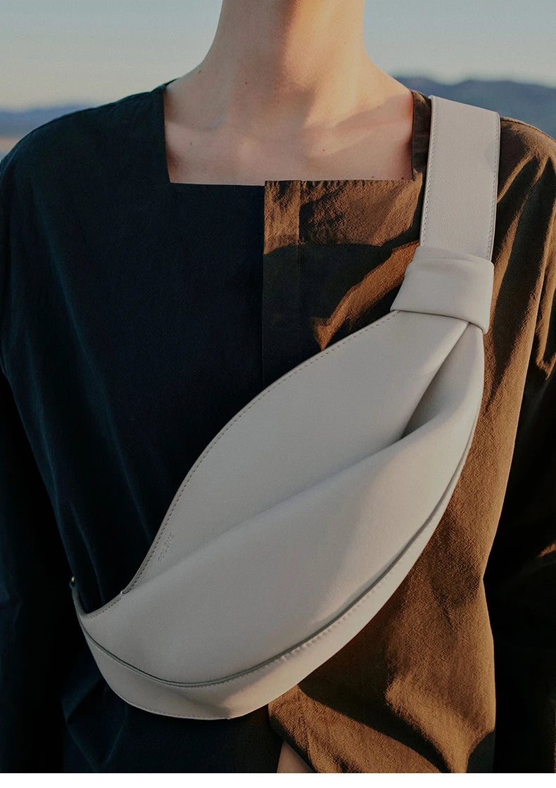 New large capacity pillow shaped personalized niche travel smooth cowhide crossbody bag